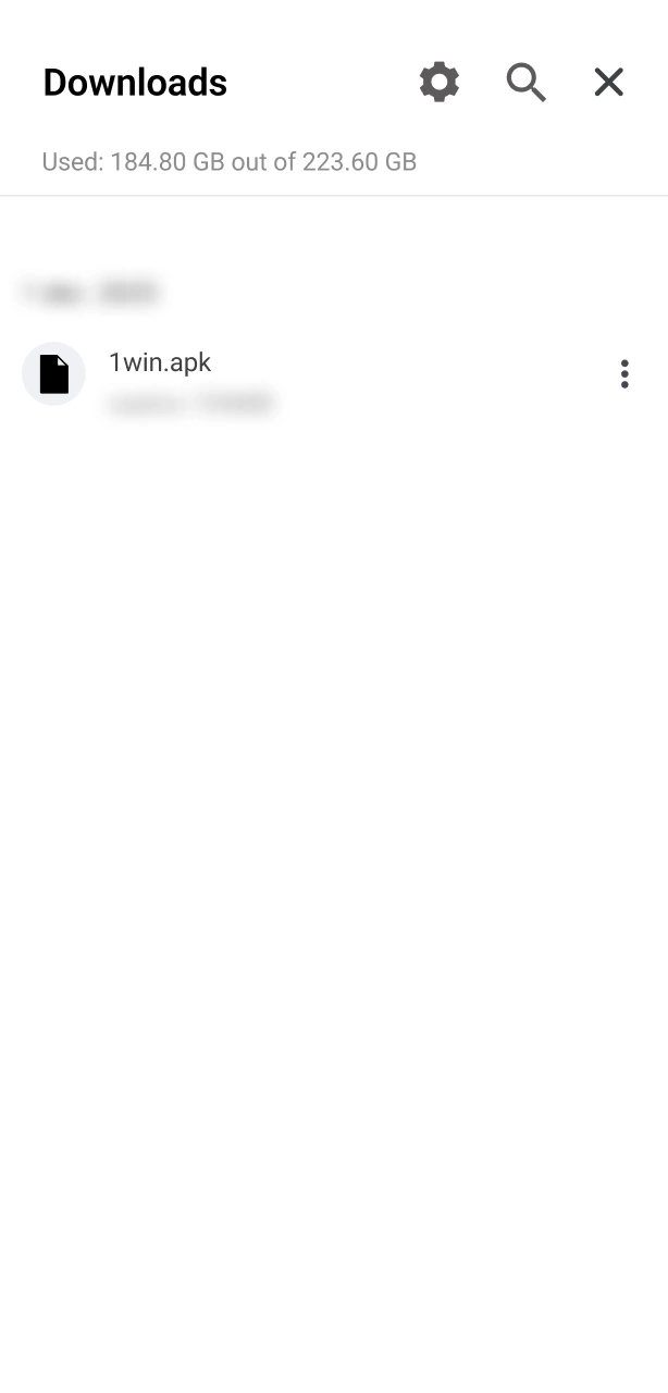 Access your Downloads folder to open the official 1win APK file.